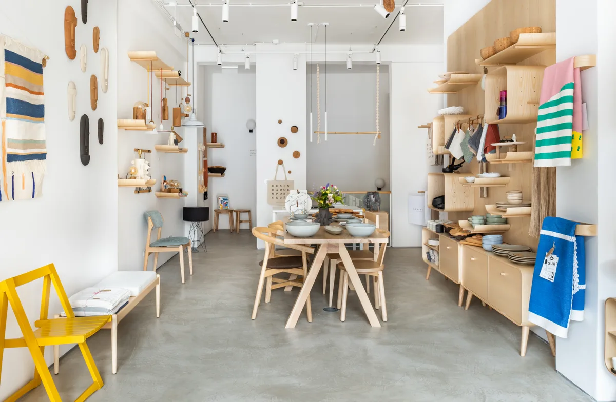 The Santo Infante store interior, with a dressed dining table and open shelving