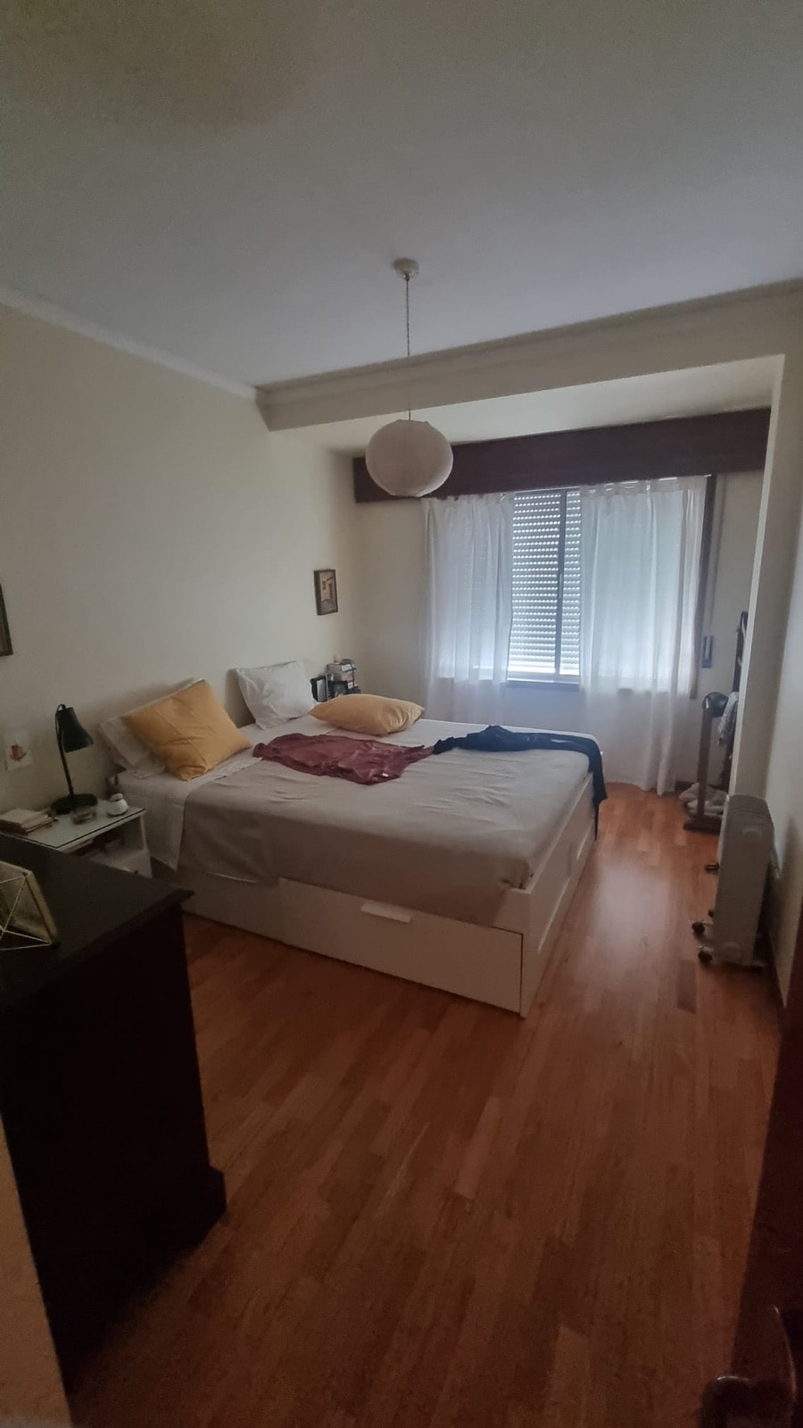Cluttered bedroom before MoveIn restyled it